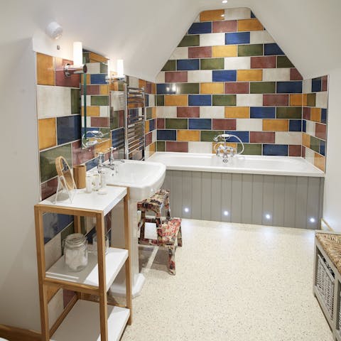 Relax after a hike with a soak in the ensuite bath, with colourful tiles
