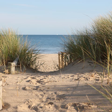 Feel the sand beneath your toes with a wander on Caswell Bay Beach