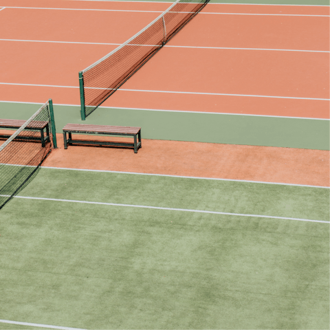 Show off your competitive side with a round of tennis at a nearby court