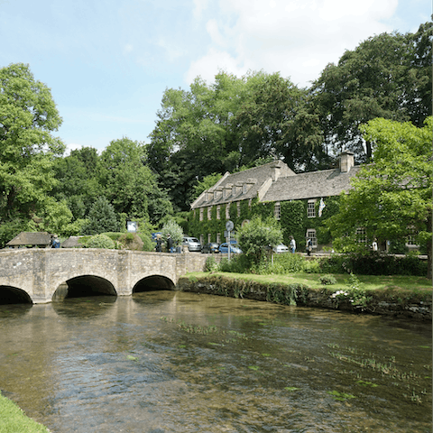 Hop in the car and head over to the quaint Cotswold village of Bibury in fifteen minutes