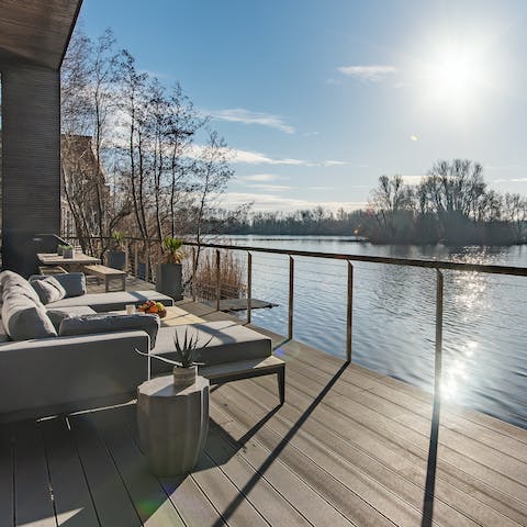 Admire the sunlight dancing on the lake's surface from the terrace