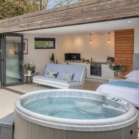 Unwind in the jacuzzi hot tub after a day of hiking in The Downs