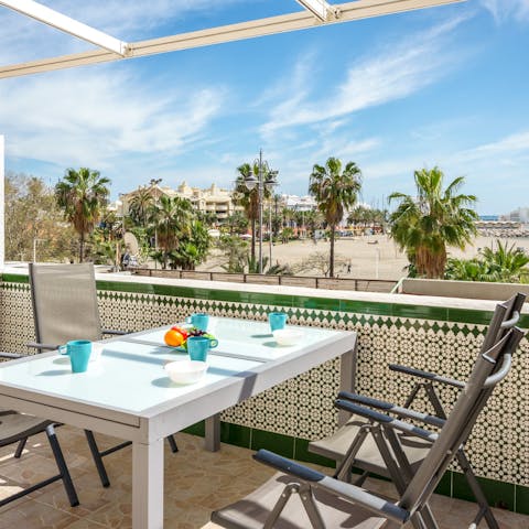 Look out over the sandy beach from your private terrace