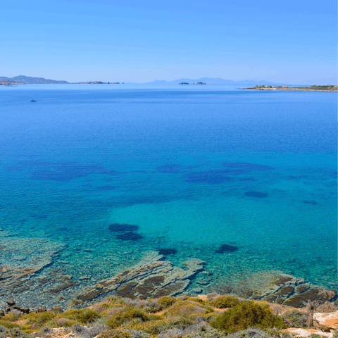 Immerse yourself in Paros' crystalline water – kid-friendly Santa Maria Beach is a short walk