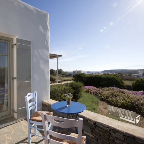 Gaze out over the herbs and lavender bushes to the sea in the distance