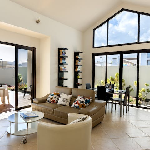 Escape the rays and relax in the double-height living room 