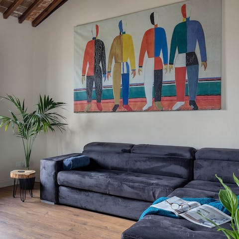 Admire the modern artworks livening up the living room