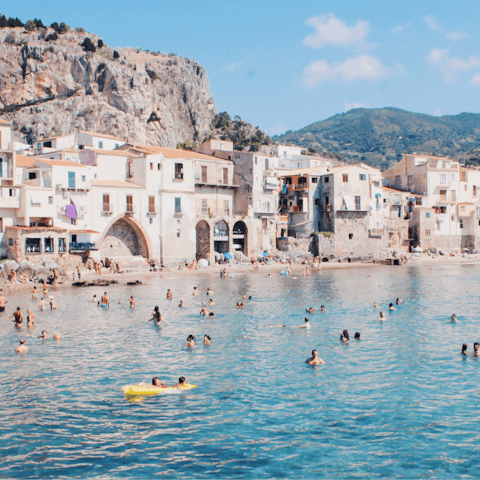 Take the thirty-minute drive to the beaches of Taormina