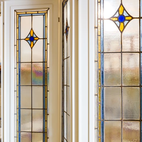 Admire the stained glass detailing in the living room