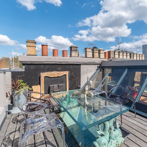 Tuck into an alfresco meal on your private roof terrace