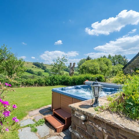 Admire the idyllic views while soaking in one of the two hot tubs