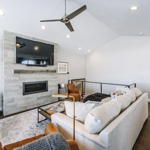 Cosy up around the fireplace for a movie on a snowy night