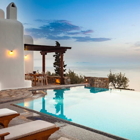 Watch the sunset over the Aegean from the private infinity pool