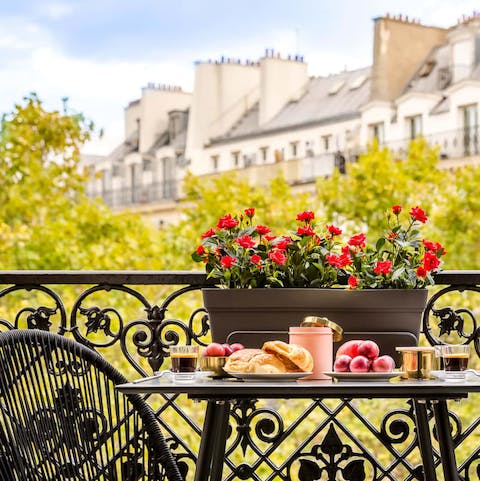 Wake up and enjoy breakfast on the balcony with gorgeous views of Paris