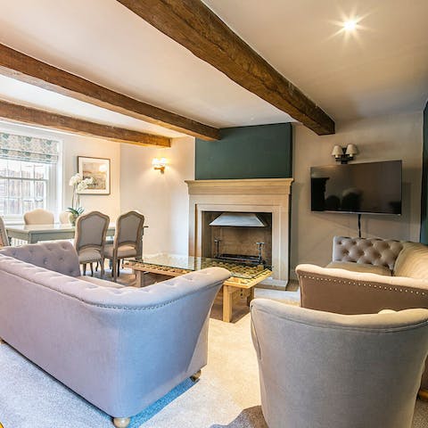 Spend cosy evenings watching movies in the grand sitting room