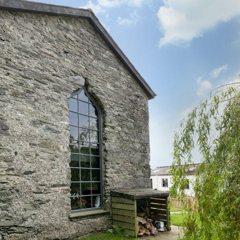 Admire the striking architecture of your home in a former chapel