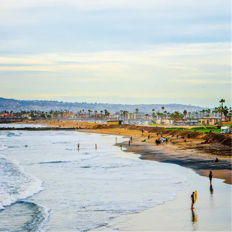 Relax on the soft sands of Ocean Beach, an eight-minute drive away