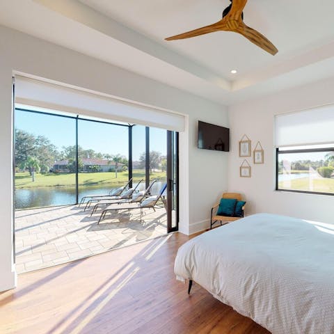 Look out across the pool and lawns from the master bedroom