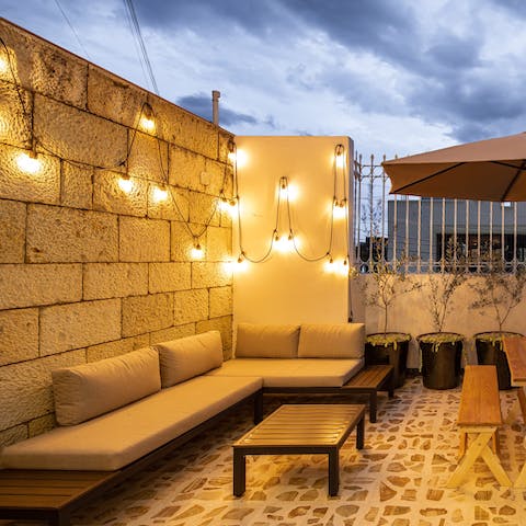 Spend warm evenings drinking wine on the outdoor sofa