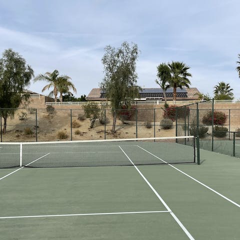 Energise your stay with a game of tennis on the shared court