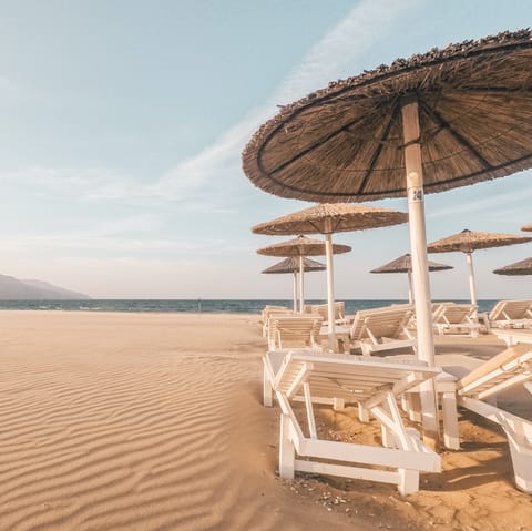 Spend the day on the golden sands of Stalos Beach, about a five-minute drive away