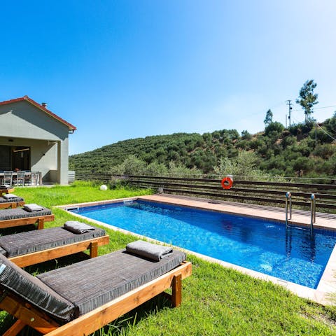 Lounge by the pool and take in the verdant countryside views