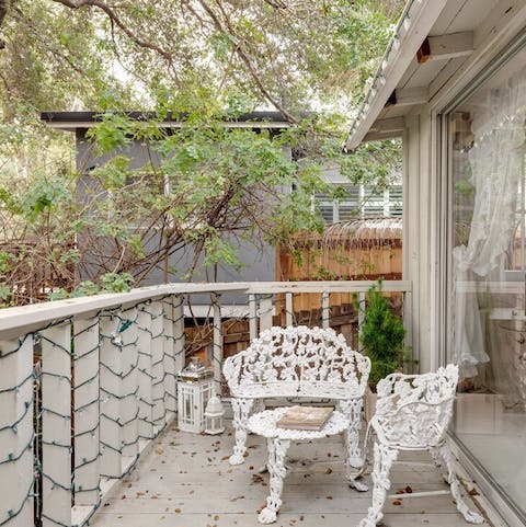 Throw open the glass door in the bedroom and start the day with coffee on the balcony