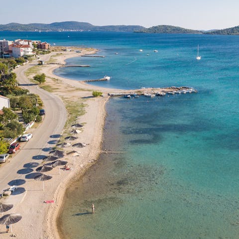 Stay just a ten-minute walk away from Strima Beach