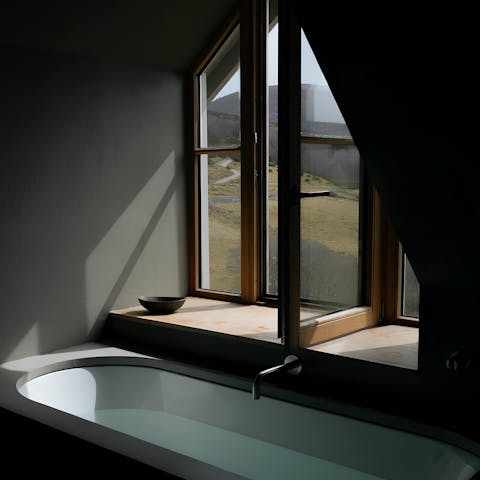 Unwind in the bath while gazing out at the scenery