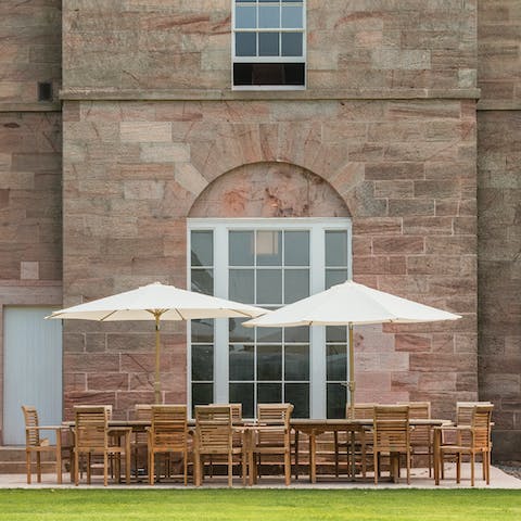 Enjoy an alfresco meal on the patio overlooking the grounds