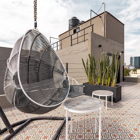 Watch the sunset over Mexico City from the building's rooftop terrace