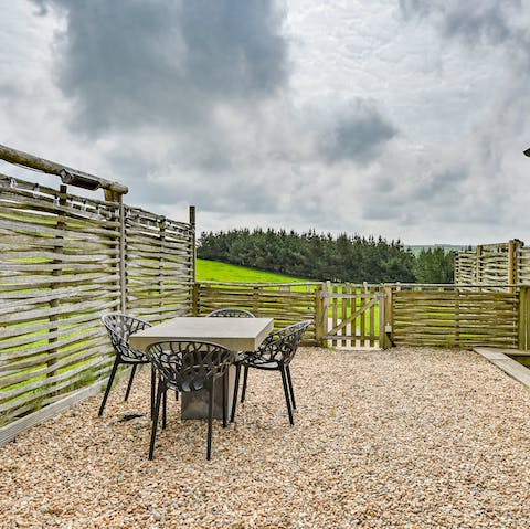 Enjoy an alfresco meal as you admire the rural views