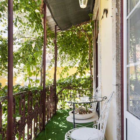 Sip your morning coffee on the leafy balcony before setting off for a day of exploring