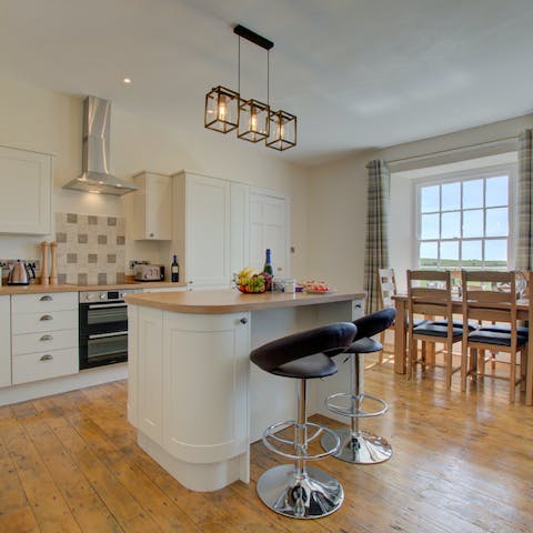 Tuck into your welcome pack and nibble on Welsh cakes at this kitchen island