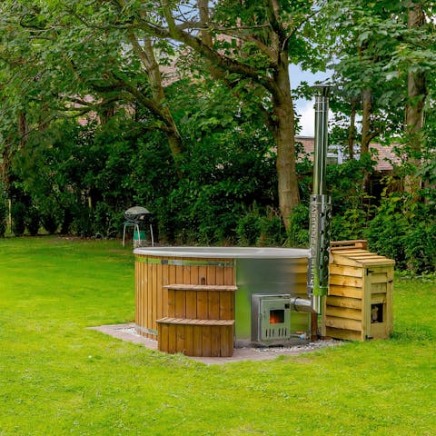 Hop into one of your two wood-fired hot tubs in the private garden