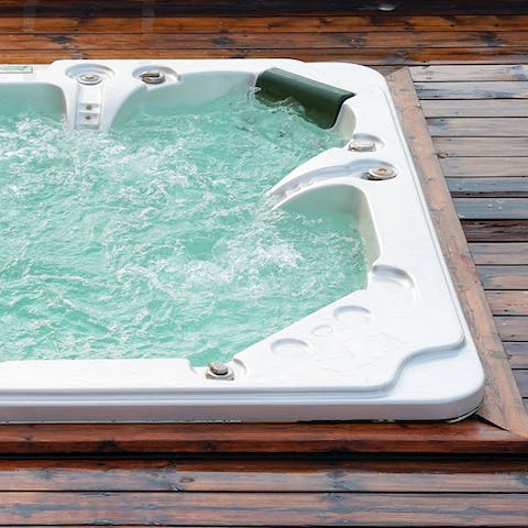 Sip a glass of fizz from the bubbling hot tub