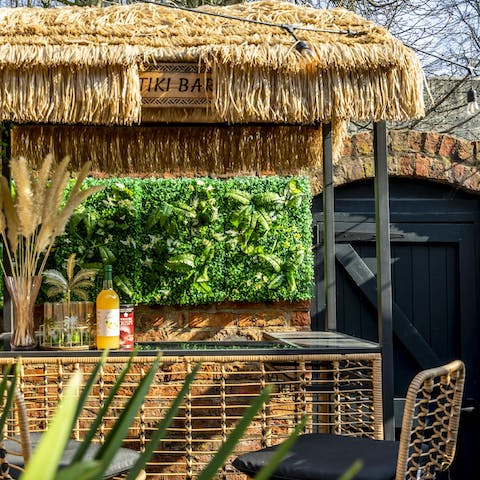 Mix your favourite cocktails at the outdoor tiki bar