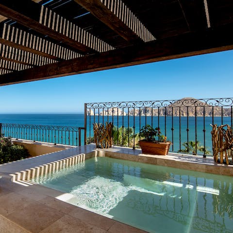 Keep one eye on the Pacific from your private hot tub on the terrace