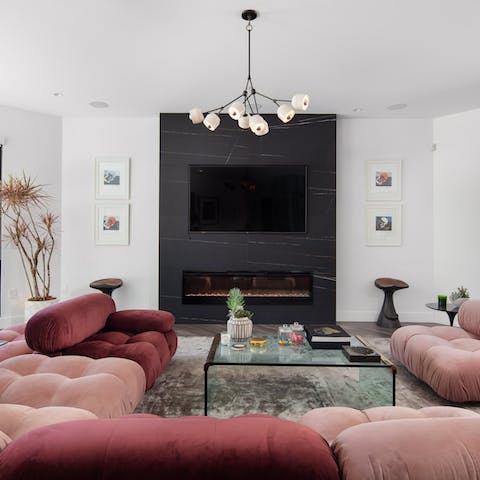 Relax in the stylish living room, complete with contemporary fireplace
