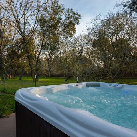Soak in the sun in the outdoor hot tub