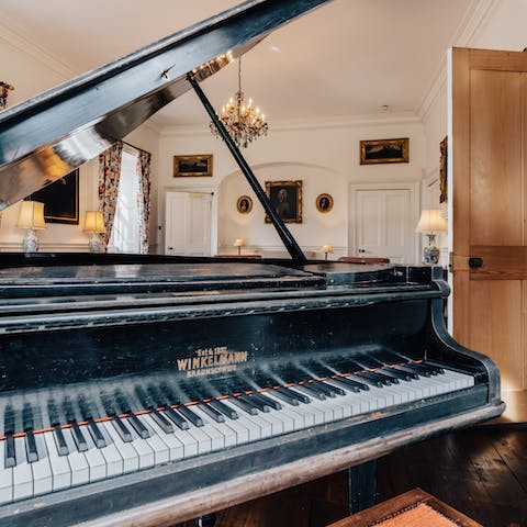 Practise your scales or play some tunes for your guests on the grand piano