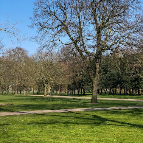 Grab a coffee to go and stroll around Victoria Park, ten minutes away on foot
