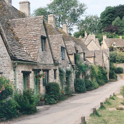 Discover picturesque Cotswold villages such as Bibury, an eighteen-minute drive