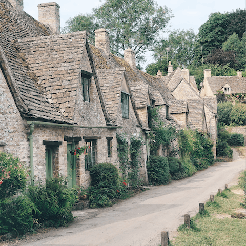Discover picturesque Cotswold villages such as Bibury, an eighteen-minute drive
