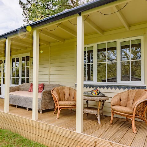 Spend balmy summer evenings relaxing on the verandah with a drink in hand
