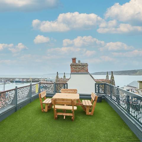 Admire the coastal views with a few drinks on the shared rooftop garden