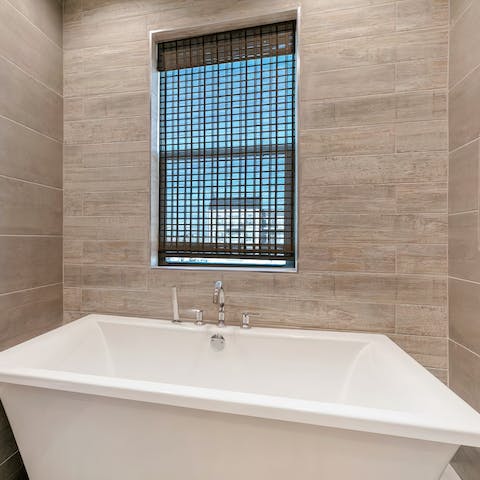 End the day with a long soak in the freestanding bathtub