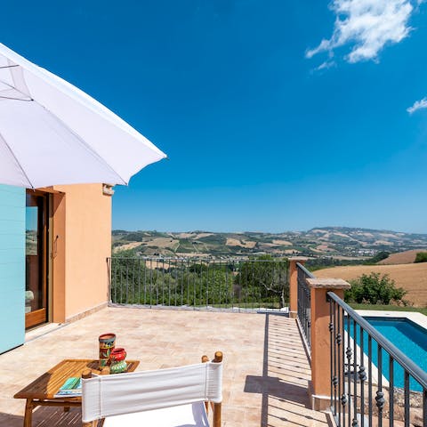 Take in the verdant valley vistas from the main bedroom's private balcony