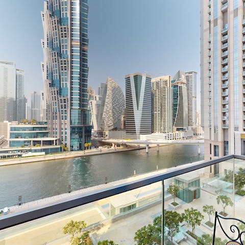 Admire the Dubai skyline and water views from the balcony