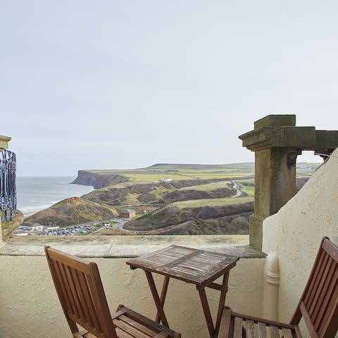 Enjoy a drink on the intimate balcony